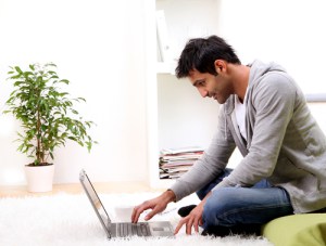 young man and news at home